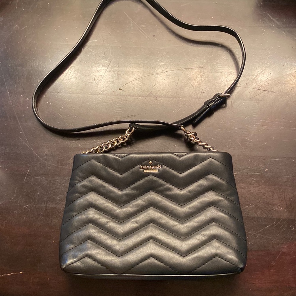 Kate Spade black leather handbag with gold chain accent